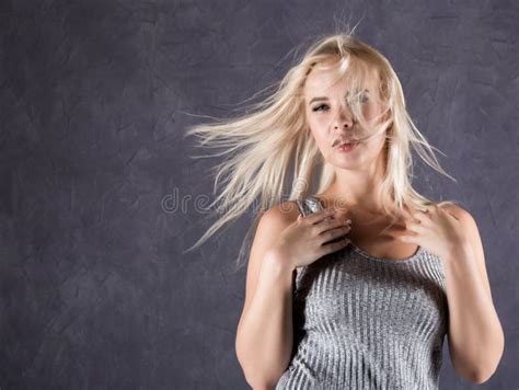 Blonde Woman With Hair In The Wind Girl With Flying Hair On A Gray