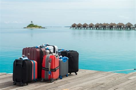 Premium Photo The Suitcases Are Ready For The Holidays On A Maldives