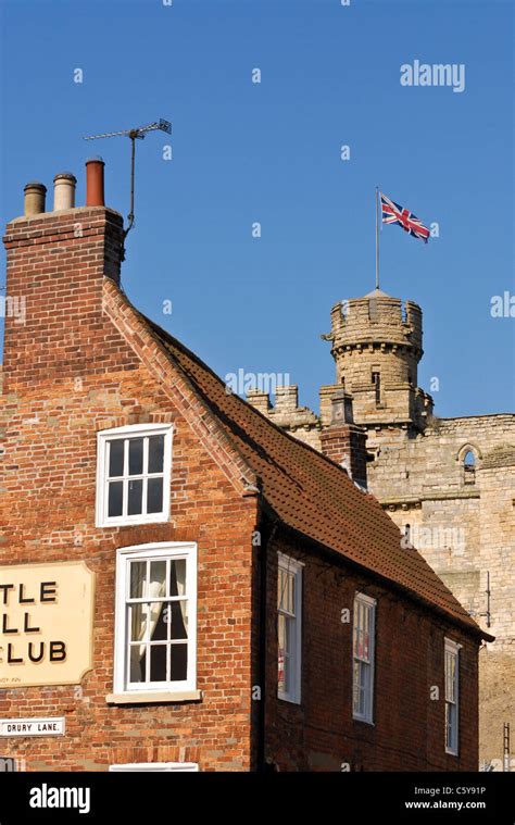 The Union Jack Flag Flies From Lincoln Castle Wall Behind The Historic