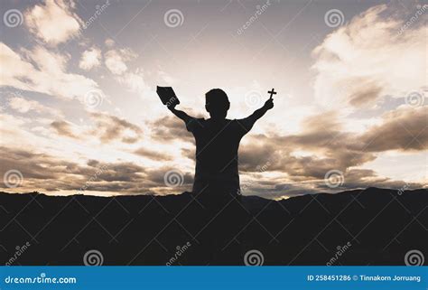 Silhouette of a Woman with Hands Raised in the Sunset Concept for ...