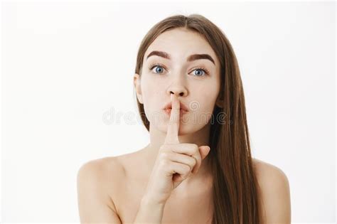 Close Up Shot Of Tender And Sensual Feminine Brunette Female Posing Naked Showing Shhh Gesture
