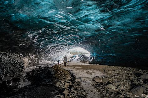 Hikers in an Ice Cave InteriorFree Stock Photo