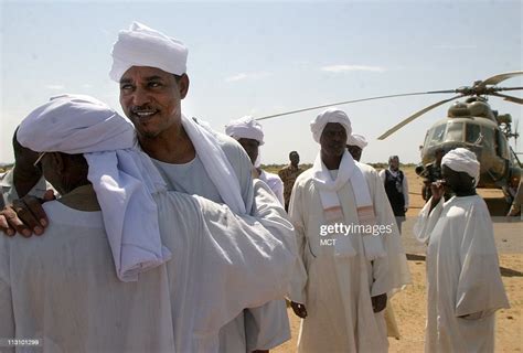 Tribal leader Musa Hilal, second from left, is greeted as he visits ...