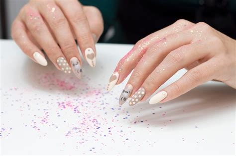 Premium Photo Manicure Drawing On The Nails Nude Nail Polish