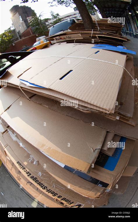 Cardboard In Residential Trash Bundled For Pick Up And Recycling On