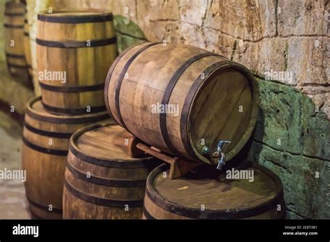 Wine Barrels Stacked In The Old Cellar Of The Winery Stock Photo Alamy