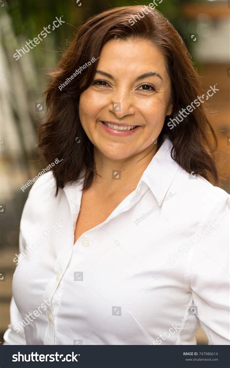 Mature Hispanic Woman Smiling Stock Photo Edit Now 747986614