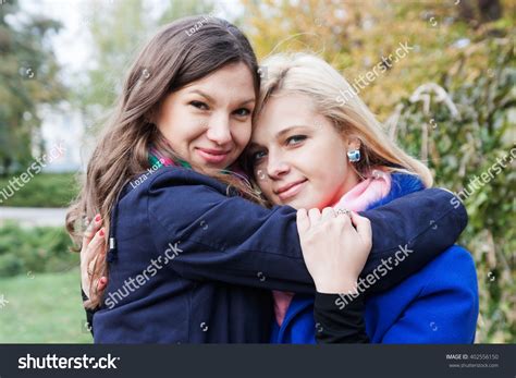 Happy Woman Hugs Her Girlfriend On Stock Photo 402556150 Shutterstock