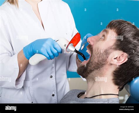 Doctor Examines The Oral Cavity On Tooth Decay Caries Protection