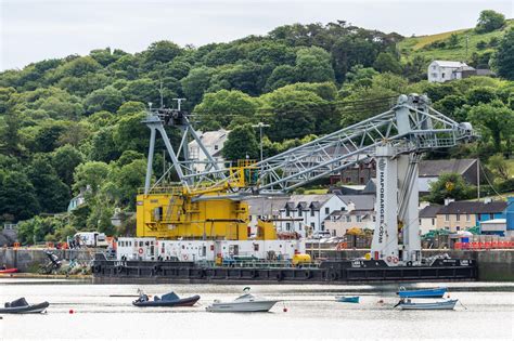 Dramatic Images Show Ship Being Pulled By Crane From Cork Harbour After