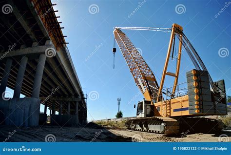 A Panoramic View Of A Road Overpass Under Construction And A Yellow