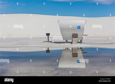 Space Age Picnic Shelters Reflecting In Pond From Recent Heavy Rains In