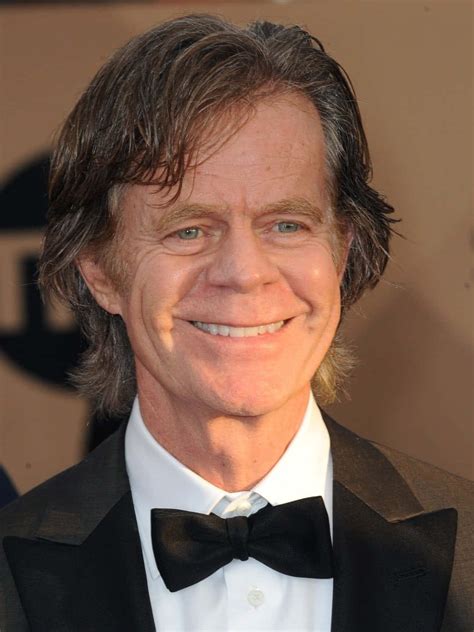 Download William H Macy Posing In A Stylish Suit Wallpaper