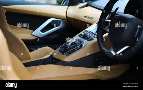 A 2012 Lamborghini Aventador With Aluminium And Tan Leather Centre Console With Red Engine Start ...