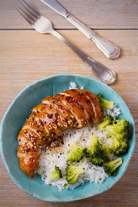 Glased Chicken Breast Rice And Broccoli As Garnish Chicken In