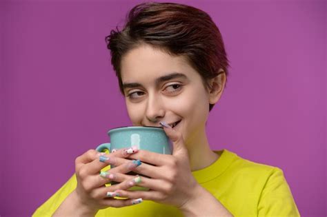Premium Photo A Barely Awake Pretty Brunette Enjoys Her Morning Tea Or Coffee