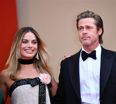 Margot Robbie Addresses Backlash Over Unscripted Brad Pitt Kiss