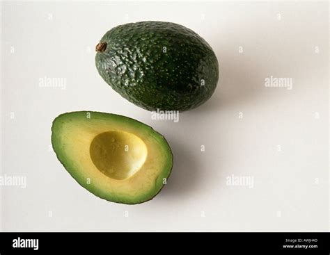 Avocado and avocado half Stock Photo - Alamy