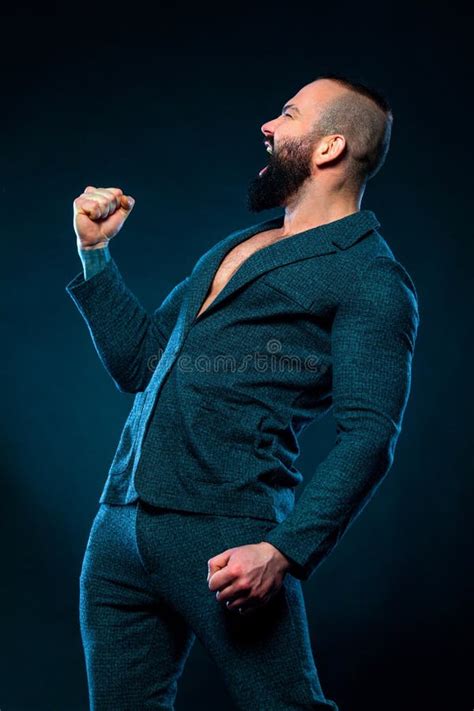 Portrait Of Happy Handsome Stylish Bearded Man Bodybuilder With Naked Torso In Elegant Suit