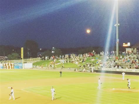 Premium Photo | People playing soccer field against sky