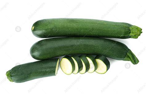 Cut And Whole Green Ripe Zucchini Isolated On White Top View Stock