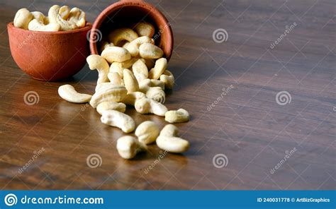 Roasted Salted Raw Cashew Nuts In Wooden Bowl On Rustic Table Healthy