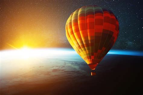 Premium Photo Hot Air Balloon Flies In Space With Stars Over Planet Earth With Sunset