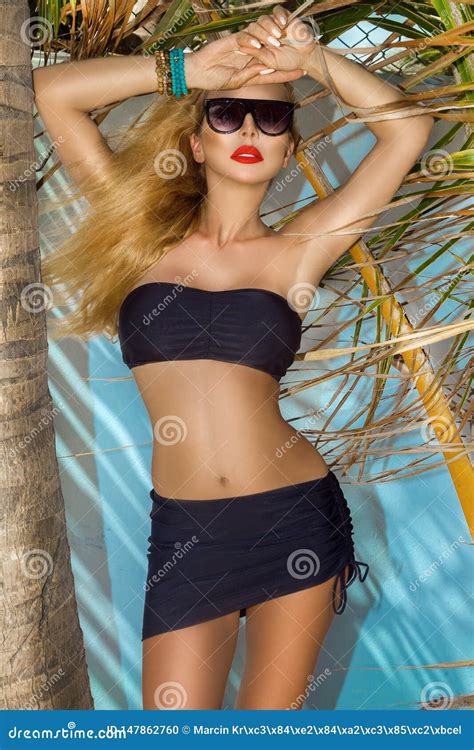 Beautiful Woman In Bikini Posing On The Caribbean Beach Stock Photo