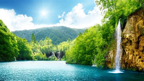 Summer Sunny Day And Wonderful Waterfall In The Nature