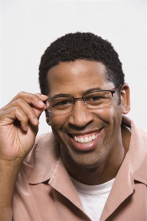 African American Man Trying On Glasses Isolated Over White Stock Image