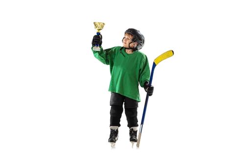 Free Photo Champion Little Hockey Player With The Stick On Ice Court