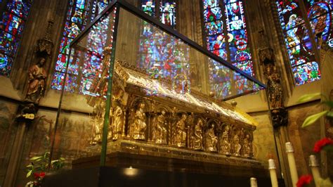 An Ornate Alter In Front Of Stained Glass Windows