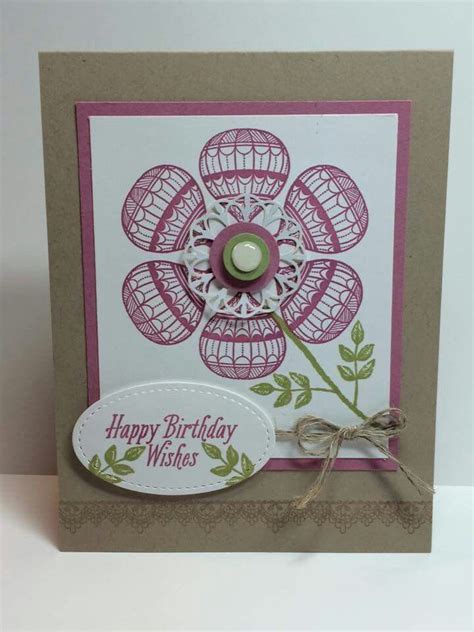 A Happy Birthday Card With A Flower On The Front And A Tag Attached To It