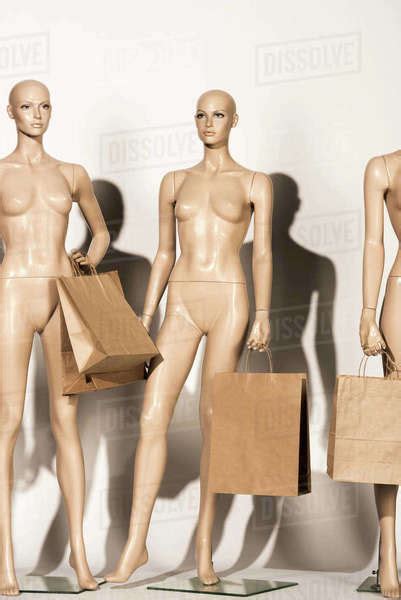 Naked Bald Mannequins With Paper Bags On White Royalty Free Stock Photo Dissolve