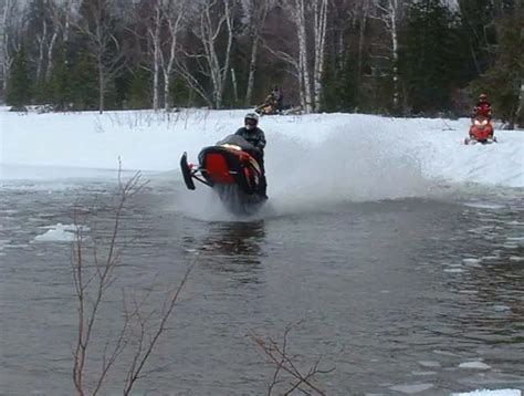 Snowmobiles Skipping Water - She Males Free Videos