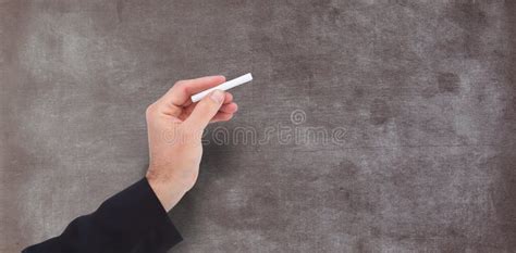 Composite Image Of Hand Holding A Chalk And Writing Something Stock