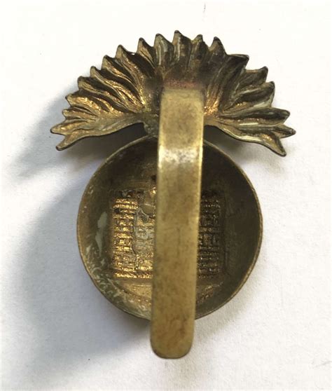 Irish Royal Inniskilling Fusiliers Brass Economy Cap Badge