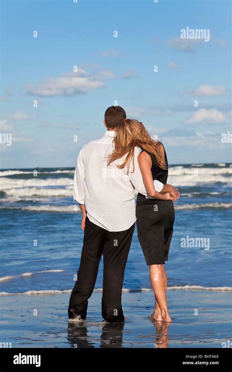 A Young Man And Woman Romantic Couple In Love Arms Around Each Other