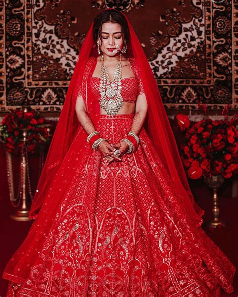 Neha Kakkars Red Falguni Shane Peacock Lehenga Will Remind You Of