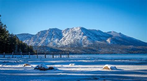 Snow Covered Beach and Mountains at Lake Tahoe, California Stock Photo ...