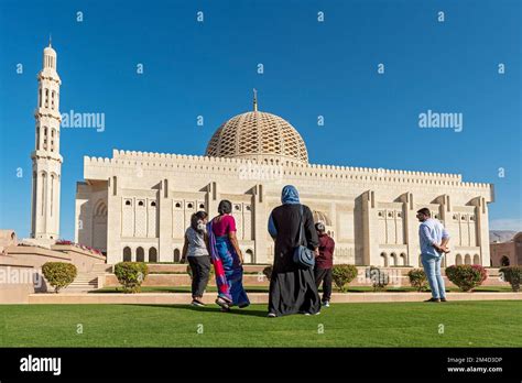 Indian family visiting Sultan Qaboos Grand Mosque, Muscat, Oman Stock ...