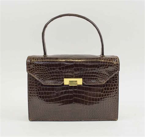 HermÈs Vintage Brown Crocodile Leather Handbag Foldover Top With Push Lock Front Closure Gold