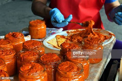 Bosnian Women Pack Freshly Cooked Ajvar Into Glass Jars On September