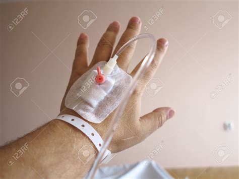 Arm Of A Male Patient In The Hospital With An Iv Intravenous Drip Stock