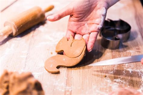 Premium Photo Close Up Hands Kneading A Dough On A Wooden Table