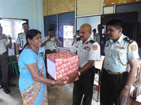 Sri Lanka army distributes uniforms at Kilinochchi school | Tamil Guardian