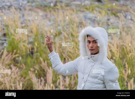 A Gay Wear Winter Clothes Walking In A Flowering Meadow In Winter The Weather Getting Cool