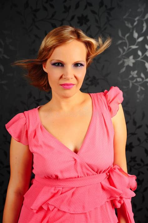 Blonde Girl In A Pink Dress In The Studio Stock Photo Image Of