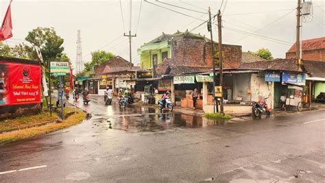 Sukoharjo - May 16, 2022 - motorcyclists pass through the wet asphalt ...