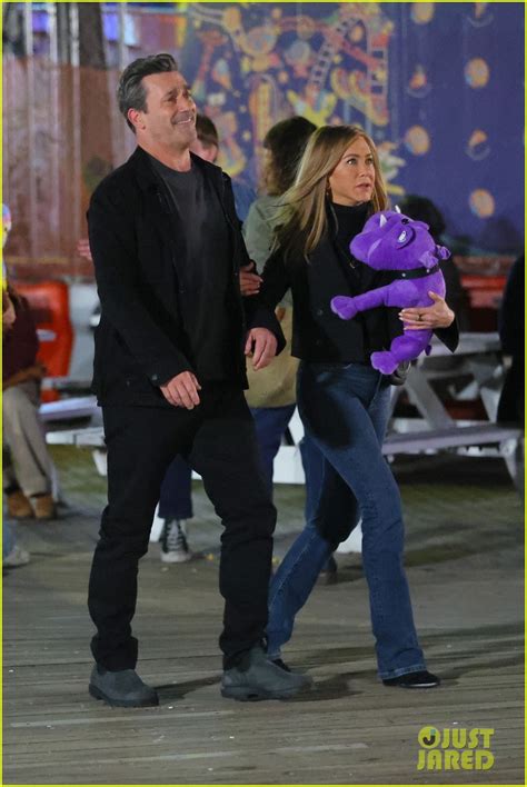 Jon Hamm Wins Jennifer Aniston A Purple Stuffed Toy At The Carnival For ...